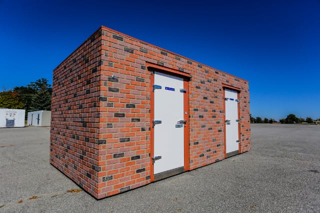 Polar King brick walk-in freezer unit outside on a sunny day