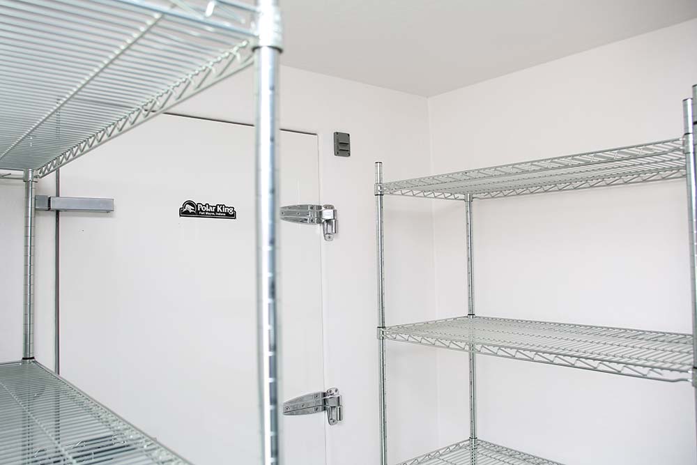 Metal shelving on the inside of a Polar King commercial freezer