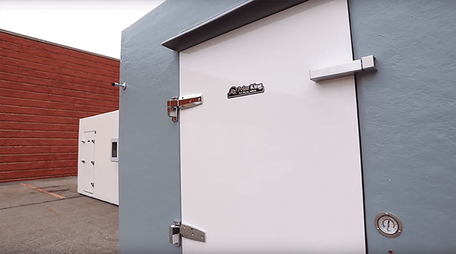White door and grey exterior of Polar King walk-in cooler