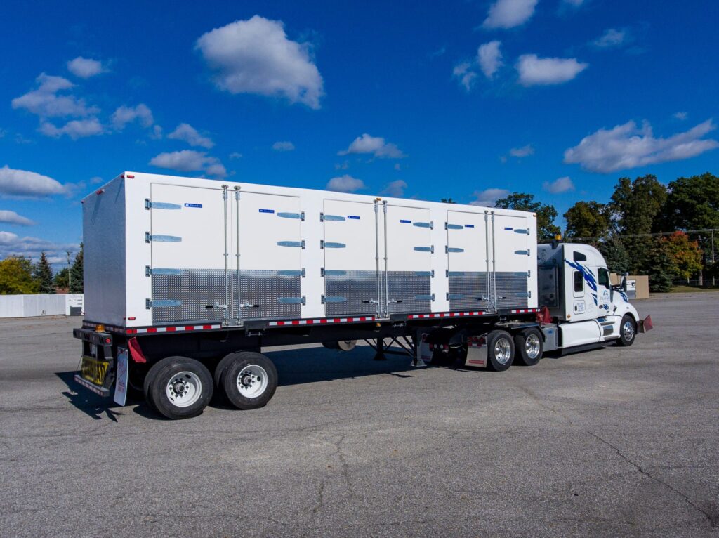 Trailer pulling a large walk-in cooler